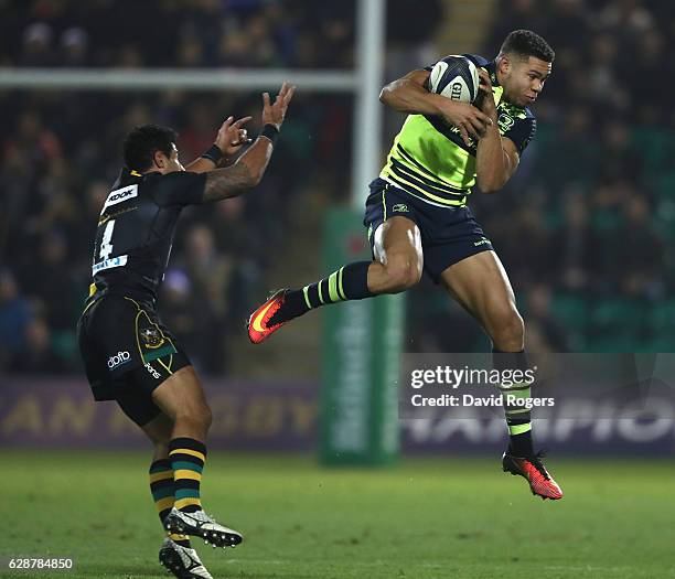 Adam Byrne of Leinster catches the ball as Ken Pisi challenges during the European Rugby Champions Cup match between Northampton Saints and Leinster...