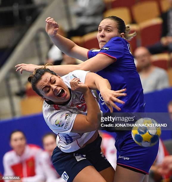 Norway's Nora Mork and Russia's Daria Dmitrieva vie for the ball during the Women's European Handball Championship Group D match between Norway and...