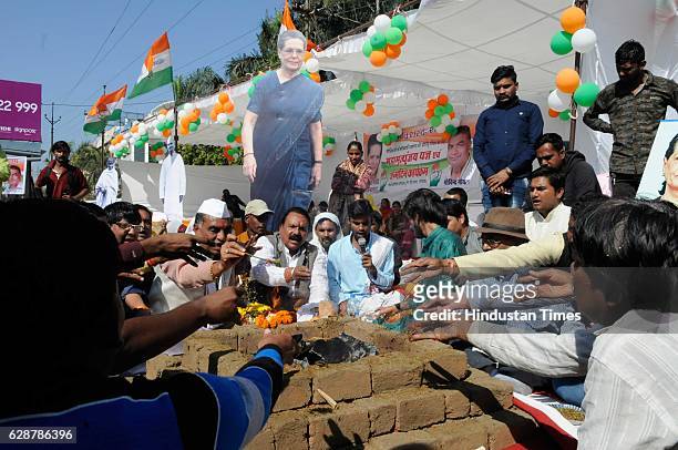 Congress party workers performing Maha Mrityunjaya Yagna for the long life of AICC President Sonia Gandhi on her birthday on December 9, 2016 in...
