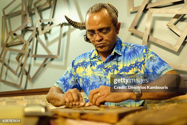 Orlando Jimenez leads Rum Tasting and Cigar Rolling Event during CMT Story Behind The Songs LIV + Weekend Day 2 at Sandals Royal Bahamian Spa Resort...