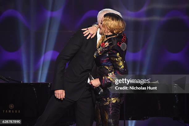 Anderson Cooper and Madonna share a moment on stage at the Billboard Women in Music 2016 event on December 9, 2016 in New York City.