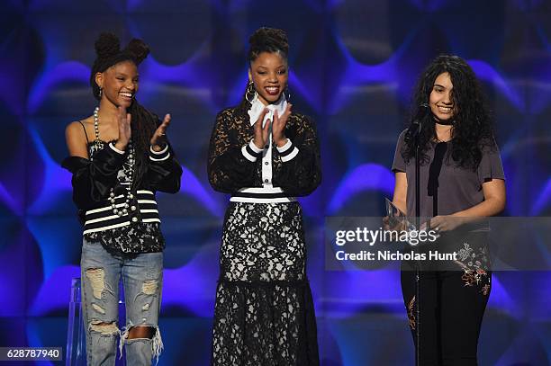 Chloe X Halle present Alessia Cara with an award on stage at the Billboard Women in Music 2016 event on December 9, 2016 in New York City.