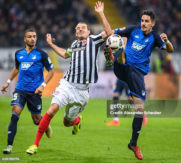 Alexander Meier of Frankfurt challenges Benjamin Huebner of Hoffenheim during the Bundesliga match between Eintracht Frankfurt and TSG 1899...