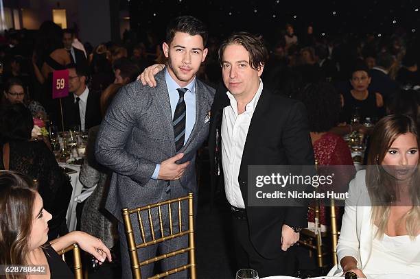 Nick Jonas and Charlie Walk attend the Billboard Women in Music 2016 event on December 9, 2016 in New York City.