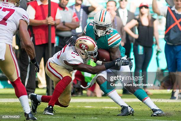 San Francisco 49ers cornerback Jimmie Ward tackles Miami Dolphins wide receiver DeVante Parker during the NFL football game between the San Francisco...