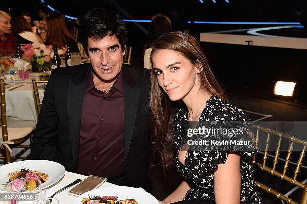 David Copperfield and Chloe Gosselin attend the Billboard Women in Music 2016 event on December 9, 2016 in New York City.