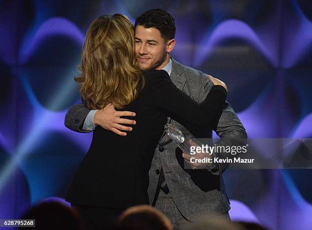 Nick Jonas and Shania Twain speak onstage during the Billboard Women in Music 2016 event on December 9, 2016 in New York City.
