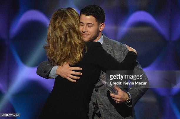 Nick Jonas and Shania Twain speak onstage during the Billboard Women in Music 2016 event on December 9, 2016 in New York City.