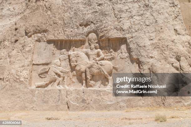 the triumph of shapur i over the roman emperors valerian and philip the arab in naqsh-e rustam - naqsh e rustam stock pictures, royalty-free photos & images