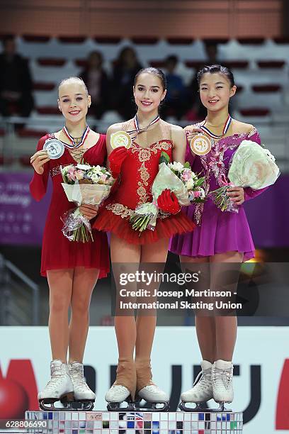 Anastasiia Gubanova and Alina Zagitova of Russia and Kaori Sakamoto of Japan pose during Junior Ladies medal ceremony on day two of the ISU Junior...