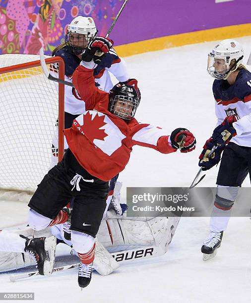 Russia - Canadian forward Marie-Philip Poulin celebrates with her teammates after scoring the equalizer in the third period during the women's ice...