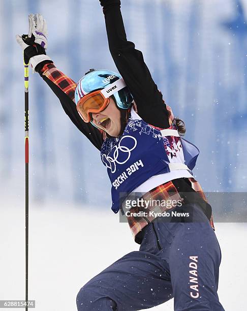 Russia - Canada's Marielle Thompson celebrates after crossing the finish line to win gold in the women's freestyle skiing cross of the Winter...