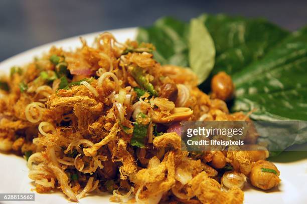 thai spicy herbal salad - lifeispixels stock pictures, royalty-free photos & images