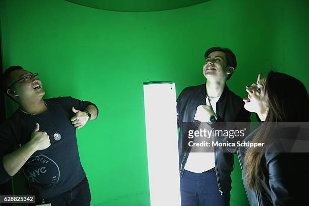 Jake T. Austin takes a photo in the 360 snowglobe Photobooth at Tinashe LIVE + Z100 Jingle Ball Viewing Party at Samsung 837 on December 9, 2016 in...