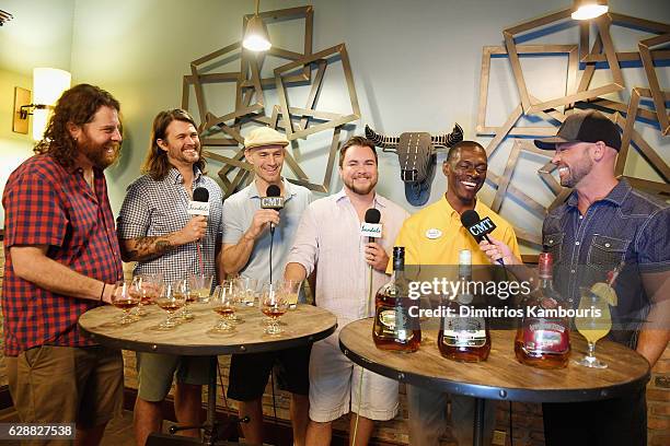 Bartender Andrew Dawkins leads Rum Tasting and Cigar Rolling Event joined by recording artists James Young, Chris Thompson, Jon Jones, and Mike Eli...