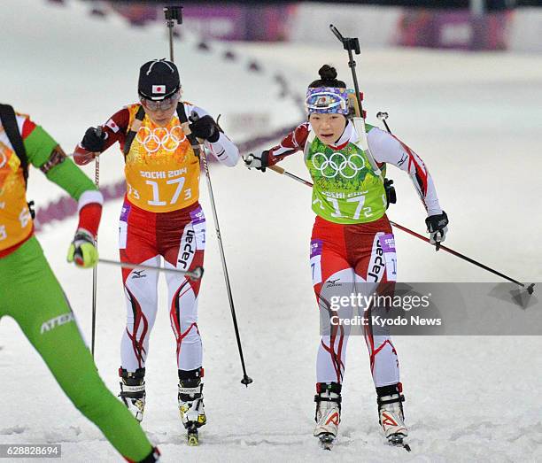 Russia - Japan's second runner Yuki Nakajima tags third runner Miki Kobayashi in the women's biathlon 4x6-kilometer relay at the Laura Cross-country...