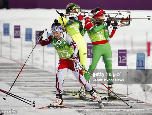 Russia - Japan's Yuki Nakajima starts her sprint after shooting her rifle in the women's biathlon 4x6-kilometer relay at the Laura Cross-country Ski...