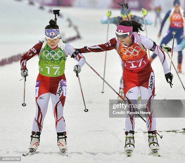 Russia - Japan's first runner Fuyuko Suzuki tags second runner Yuki Nakajima in the women's biathlon 4x6-kilometer relay at the Laura Cross-country...