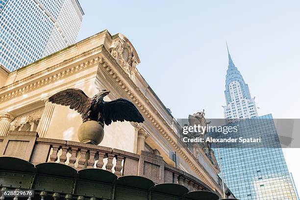 cast iron eagle statue at grand central terminal, new york city, ny, usa - grand central terminal nyc stock pictures, royalty-free photos & images
