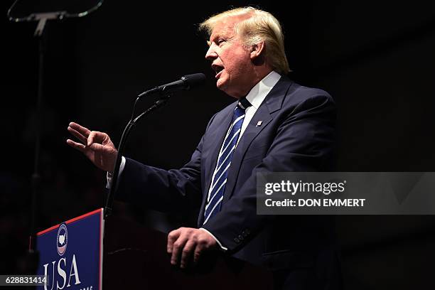 President-elect Donald Trump speaks during the USA Thank You Tour December 9, 2016 in Grand Rapids, Michigan. / AFP / DON EMMERT