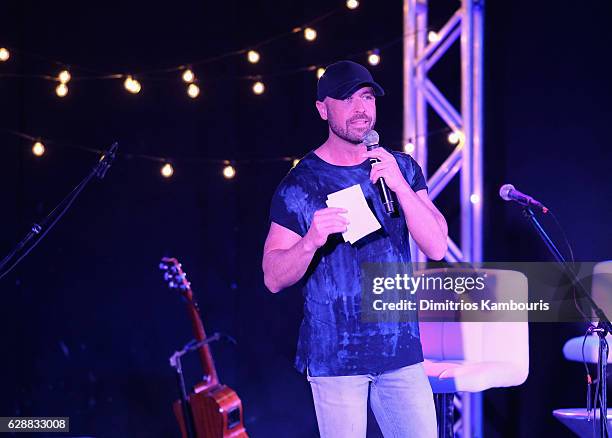 Host Cody Alan speaks onstage during CMT Story Behind The Songs LIV + Weekend at Sandals Royal Bahamian Spa Resort & Offshore Island - Day 2 at...