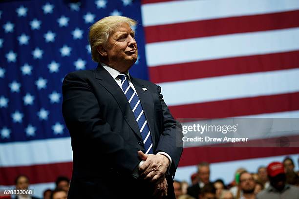 President-elect Donald Trump looks on during a rally at the DeltaPlex Arena, December 9, 2016 in Grand Rapids, Michigan. President-elect Donald Trump...