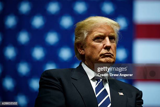 President-elect Donald Trump looks on during a rally at the DeltaPlex Arena, December 9, 2016 in Grand Rapids, Michigan. President-elect Donald Trump...