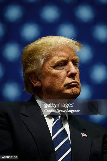President-elect Donald Trump looks on during a rally at the DeltaPlex Arena, December 9, 2016 in Grand Rapids, Michigan. President-elect Donald Trump...