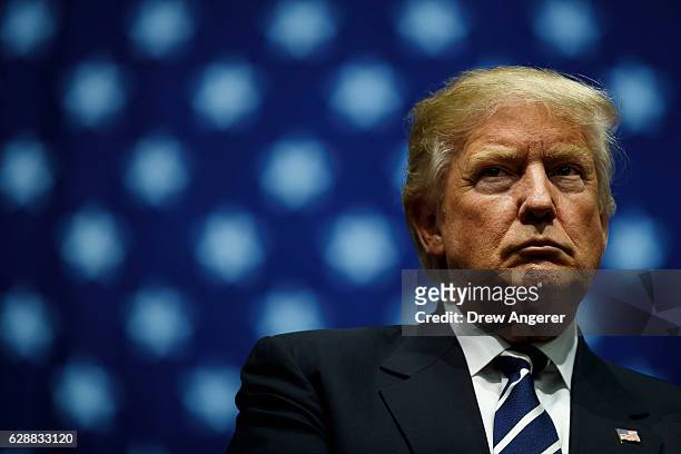 President-elect Donald Trump looks on during a rally at the DeltaPlex Arena, December 9, 2016 in Grand Rapids, Michigan. President-elect Donald Trump...