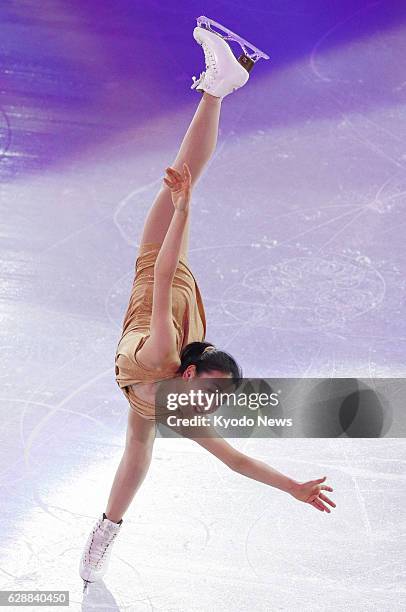 Russia - Mao Asada of Japan performs a spiral in a Sochi Winter Olympics figure skating exhibition gala at the Iceberg Skating Palace in Sochi,...
