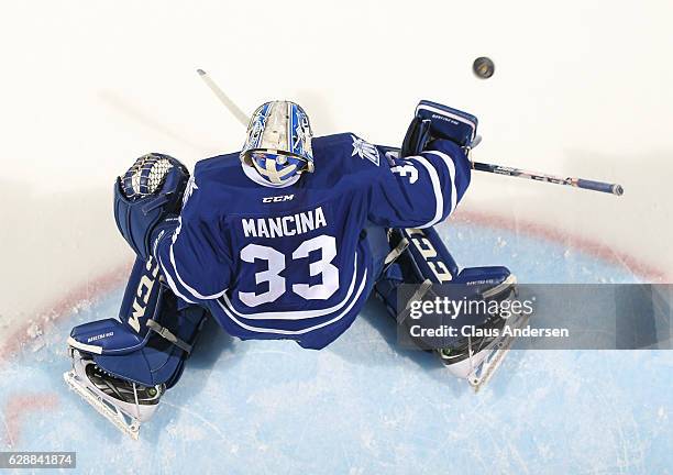 Matthew Mancina of the Mississauga Steelheads stops a shot in the warm-up prior to playing against the London Knights in an OHL game at Budweiser...