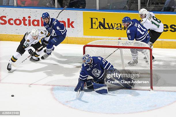 Nicolas Hague of the Mississauga Steelheads holds up Adrian Carbonara of the London Knights during an OHL game at Budweiser Gardens on December 9,...