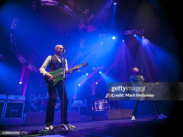 Francis Rossi,Andy Brown,John Edwards of Status Quo performing on stage at BIC on December 9, 2016 in Bournemouth, England.