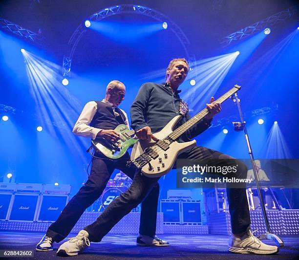 Francis Rossi,John Edwards,Andy Brown of Status Quo performing on stage at BIC on December 9, 2016 in Bournemouth, England.