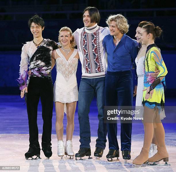 Russia - The figure skating gold medalists at the Sochi Winter Olympics in Russia line up for a photo session during a gala exhibition on Feb. 22,...