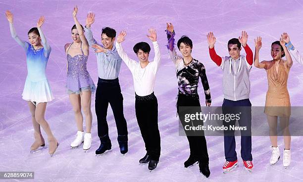 Russia - Top figure skaters at the Sochi Winter Olympics in Russia wave to the audience during a gala exhibition on Feb. 22, 2014: South Korea's Kim...