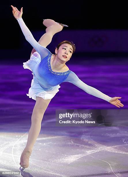 Russia - South Korean figure skater Kim Yu Na, the silver medalist in the women's singles competition at the Sochi Olympics, performs a spiral during...