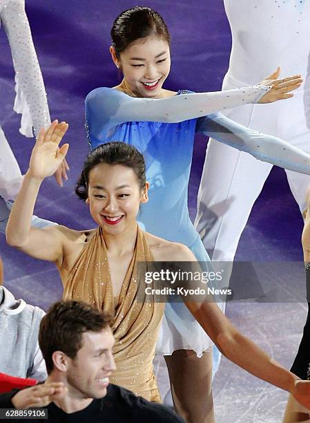 Russia - Japanese and South Korean figure skaters Mao Asada and Kim Yu Na dance during an exhibition gala on Feb. 22 at the Sochi Winter Olympics in...