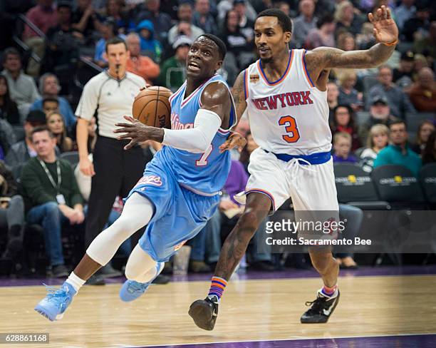The Sacramento Kings' Darren Collison drives to the basket as he's defended by the New York Knicks' Brandon Jennings at Golden 1 Center in...