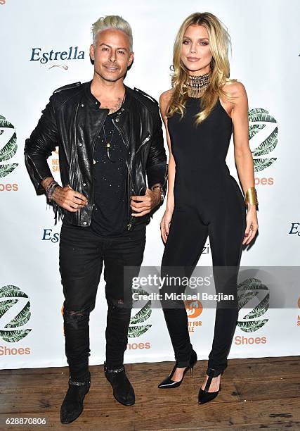 Artist Louis Carreon and actress AnnaLynne McCord arrive at Not For Sale x Z Shoes Benefit at Estrella Sunset on December 9, 2016 in West Hollywood,...