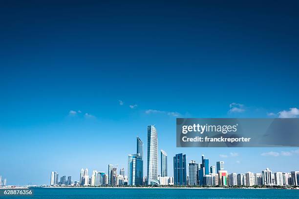 abu dhabi skyline waterfront - panoramic office stock pictures, royalty-free photos & images