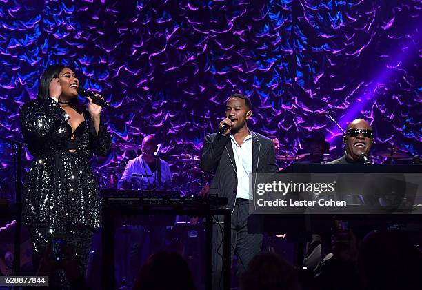 Singers Jazmine Sullivan, John Legend, and Stevie Wonder perform at Stevie's 20th Annual House Full of Toys Benefit Concert at Microsoft Theater on...