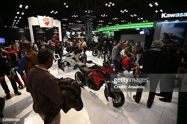 People visit the Progressive International Motorcycle Show at Javits Center in New York City on December 09, 2016. Charter partners on the...