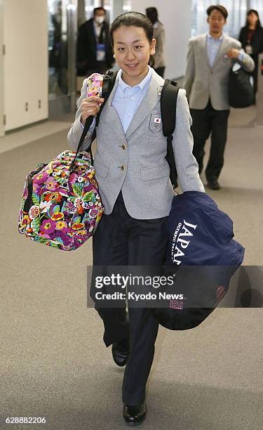 Japan - Mao Asada arrives at Narita airport near Tokyo on Feb. 25 as the Japanese figure skating squad returned from the Winter Olympics in Sochi,...