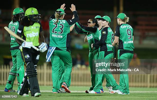 Alana King of the Stars celebrates with team mates after taking the wicket of Stafanie Taylor of the Thunder during the Women's Big Bash League match...