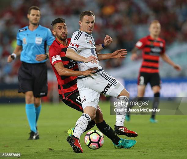 Besart Berisha of the Victory is challenged by Bruno Pinatares of the Wanderers during the round 10 A-League match between the Western Sydney...