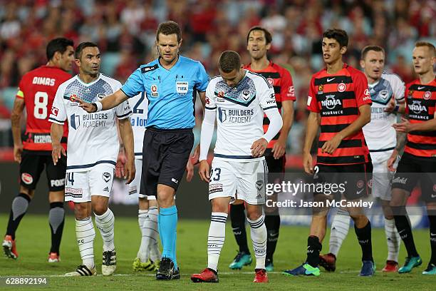 Referee Chris Beath speaks to Jai Ingham of the Victory during the round 10 A-League match between the Western Sydney Wanderers and the Melbourne...