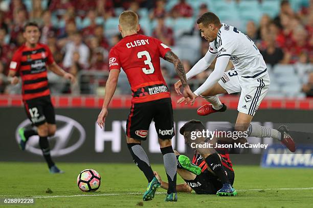 Jai Ingham of the Victory is challenged by Jonathan Aspropotamitis of the Wanderers during the round 10 A-League match between the Western Sydney...