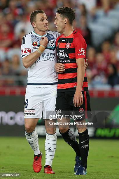 Besart Berisha of the Victory confronts Scott Neville of the Wanderers during the round 10 A-League match between the Western Sydney Wanderers and...