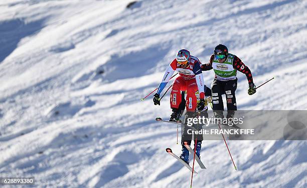 Switzerland's Alex Fiva, Canada's Brady Leman and Austria's Christoph Wahrstotter compete during the FIS Men's-final Skicross World Cup on December...